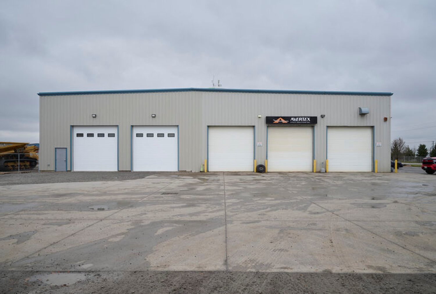Steel-frame commercial building with multiple overhead doors